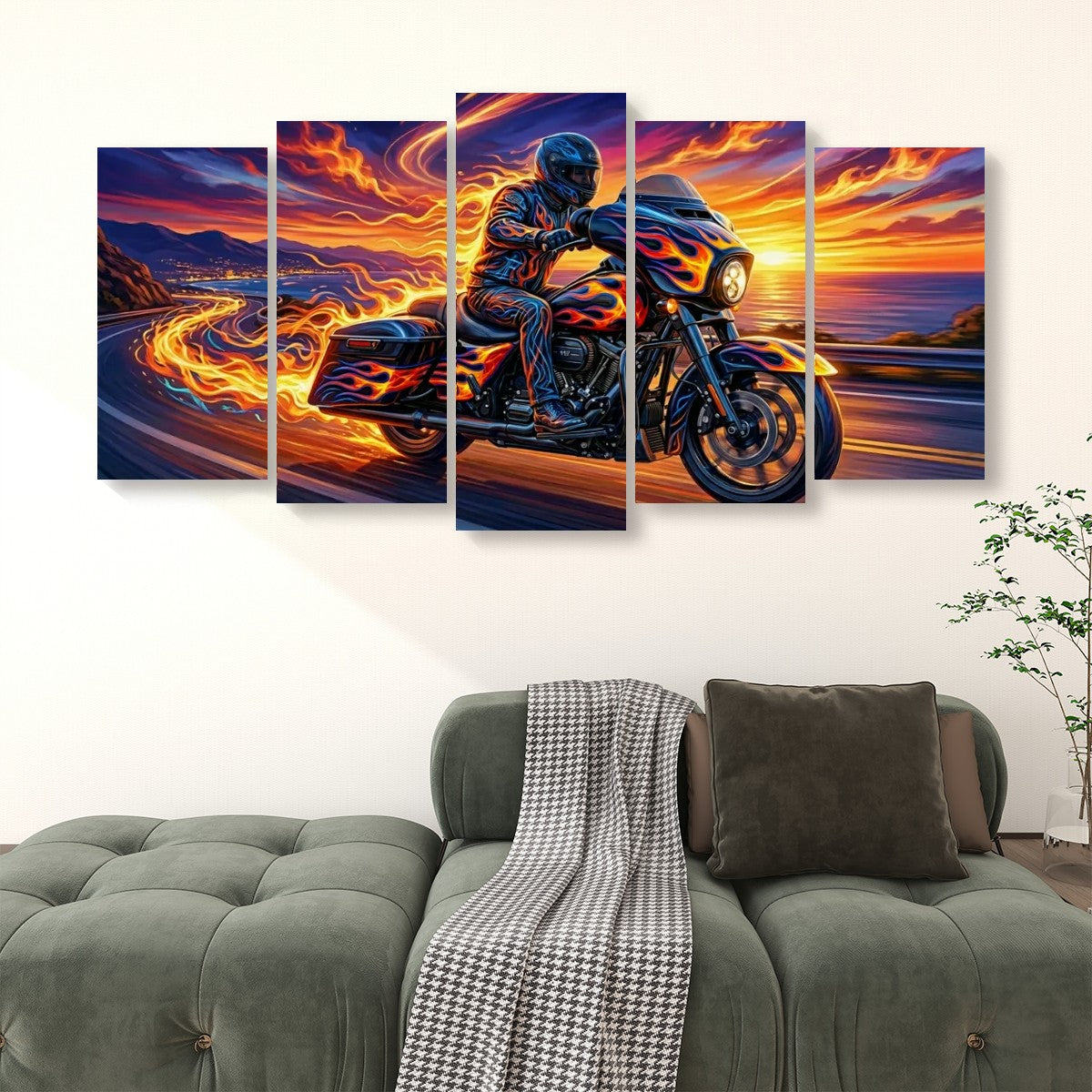 A 5-panel canvas wall art set depicting a motorcycle racer on a fiery sunset road, displayed above a green tufted sofa in a living room setting.