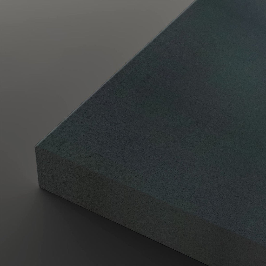 A close-up studio shot of a rectangular block or panel corner, showing a matte dark teal-blue surface with a visible side edge against a matching dark gray background.