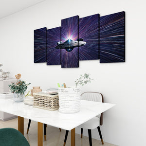 A 5-panel canvas wall art set depicting a Starship Enterprise in a purple and blue starburst space scene, displayed on a white wall above a dining table in a modern room setting.