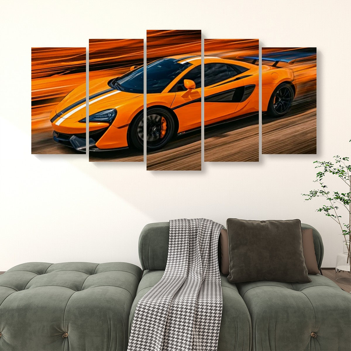 A five-panel canvas wall art set depicting a bright orange  McLaren  sports car with black racing stripes on a blurred orange and brown background, displayed above a green tufted sofa in a living room setting.