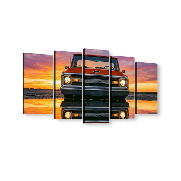 A five-panel canvas wall art set depicting the front of a vintage orange  1970 Chevrolet C10 truck at sunset, with the truck reflected in water below, shown against a plain white background.