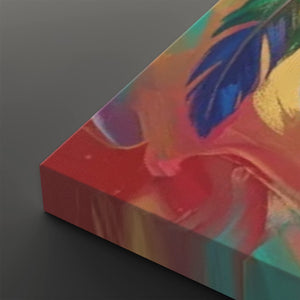 A close-up of a colorful abstract canvas print showing a textured surface with vibrant red, blue, yellow, and teal paint-like patterns on a dark gray background.