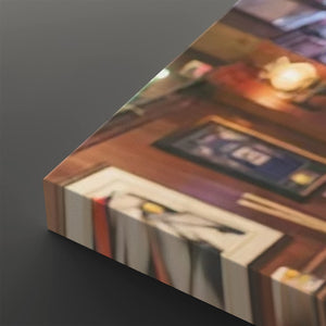 A close-up angled view of a rectangular canvas or print showing an indoor scene with warm lighting, furniture, and framed artwork, placed on a dark gray background.