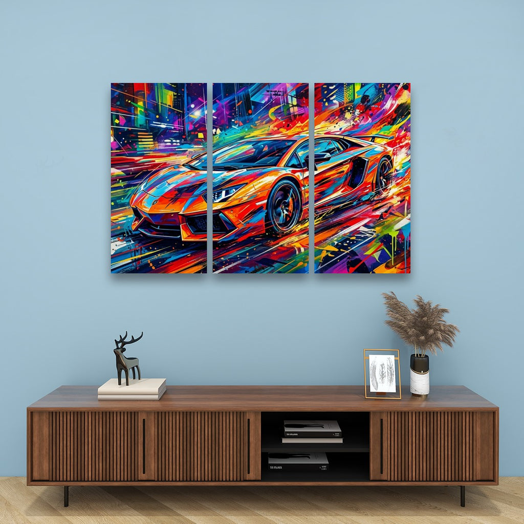 A three-panel canvas wall art print depicting a colorful, abstract sports car in a neon city scene, displayed on a light blue wall above a wooden console table.