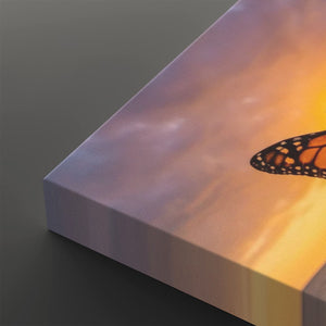 A close-up of a square canvas print showing a butterfly wing pattern against a warm sunset sky, with the canvas edge visible on a dark gray background.