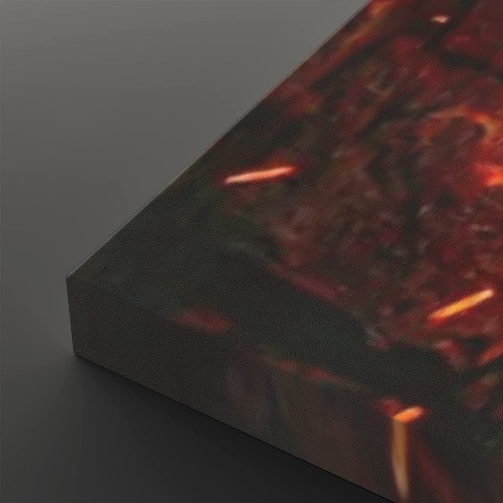 A close-up of a rectangular canvas or panel showing an abstract fiery scene with dark charcoal, red, orange, and glowing embers, photographed on a dark gray background.