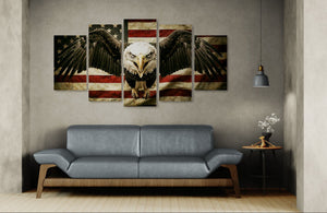 Wall art with an eagle and American flag design above a gray sofa in a living room.