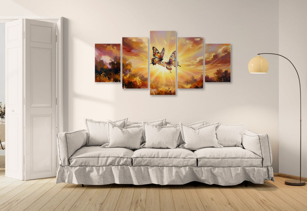 Five-panel wall art of a butterfly against a sunset sky above a white sofa.