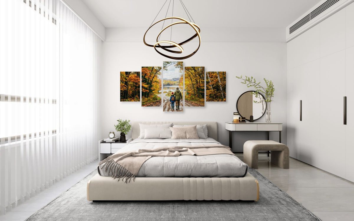 Modern bedroom with a bed, side tables, and wall art.
