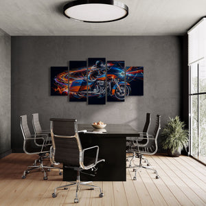 A 5-panel canvas wall art set depicting a Road Glide type motorcycle rider in motion with vibrant blue, orange, and red light trails on a black background, displayed in a modern office setting above a black conference table.