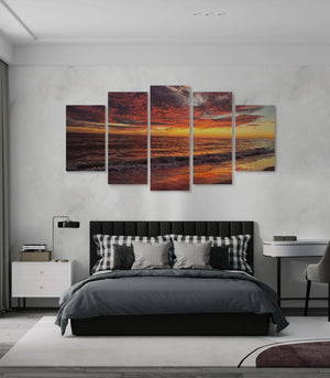 Bedroom with a large wall art piece depicting a Indian Rocks,  FL sunset over water.