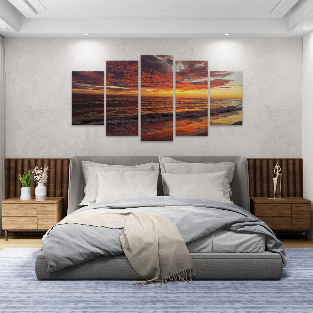 Bedroom with a large bed and wall art depicting a Indian Rocks,  FL sunset over water.