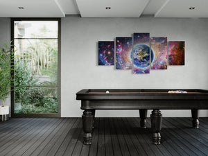 Modern room with a pool table and space-themed wall art
