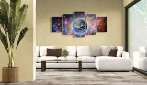 Modern living room with a large abstract wall art piece above a white sofa.