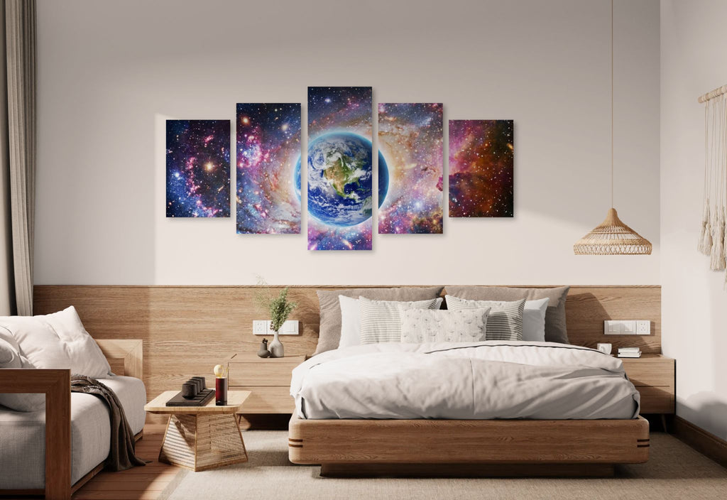 Bedroom with a large bed and wall art depicting space scenes.