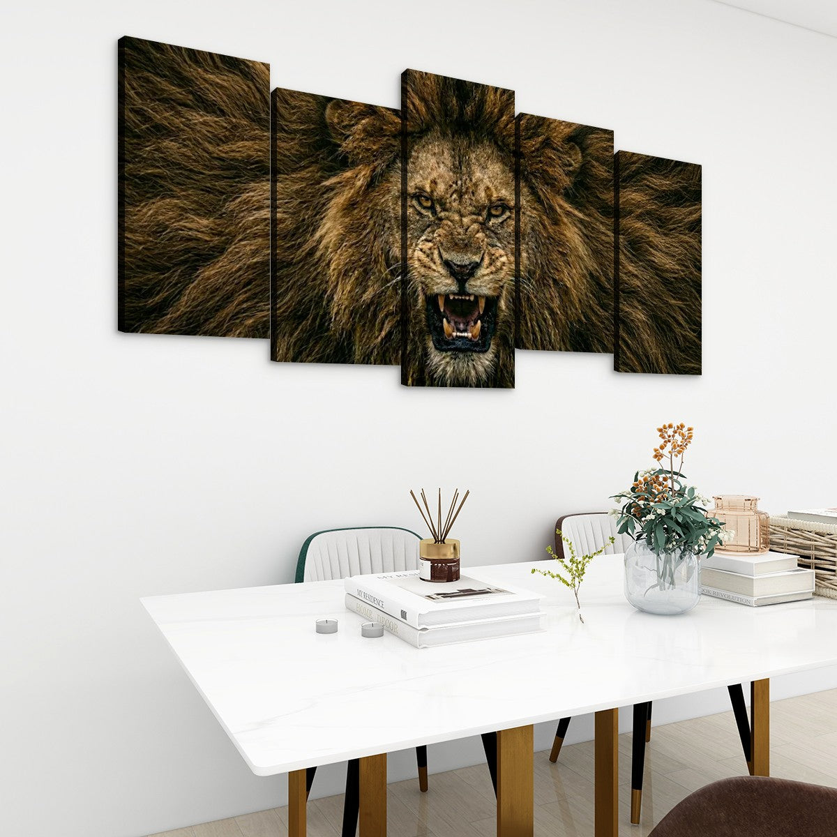 A five-panel canvas wall art set depicting a roaring lion in warm brown and black tones, displayed above a white dining table in a modern room setting.