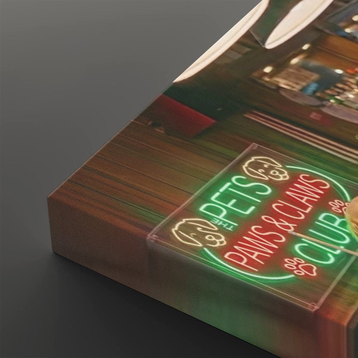A rectangular acrylic wall sign featuring a neon-style graphic that reads 'PETS PAWS & CLAMS CLUB' in green and red, shown resting on a wooden surface against a dark gray background.