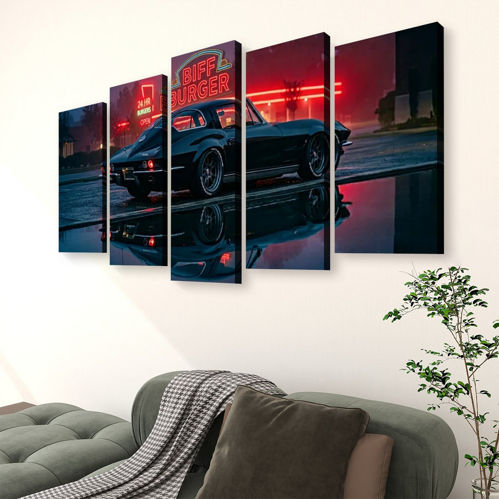 A 5-panel canvas wall art set depicting a black 1963 Split Window Chevy Corvette at night with red neon diner signage and reflections, displayed above a sofa in a living room setting.