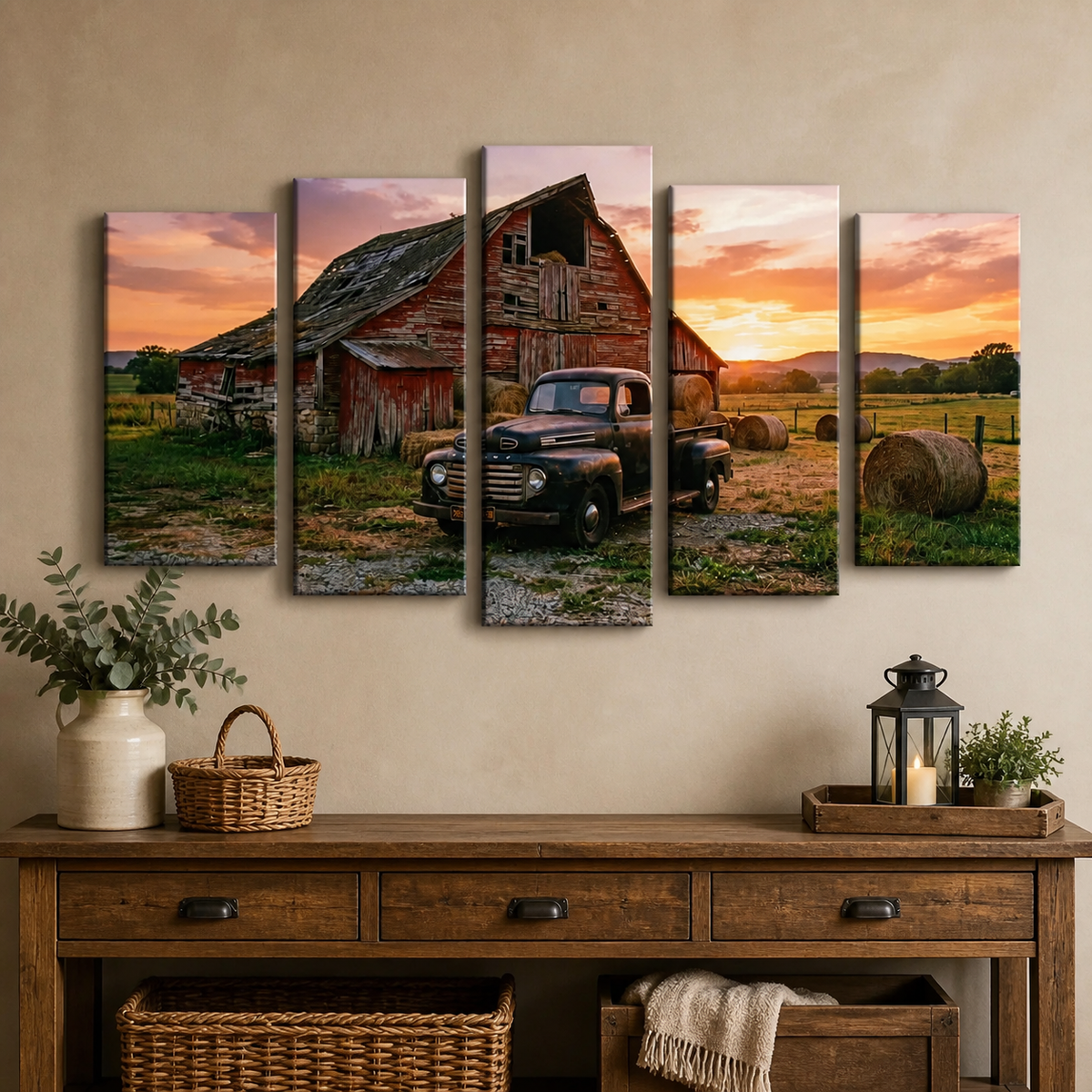 A five-panel canvas wall art set depicting a rustic red barn, a vintage 1951 Ford F1 pickup truck, and hay bales at sunset, displayed above a wooden console table in a styled room setting.
