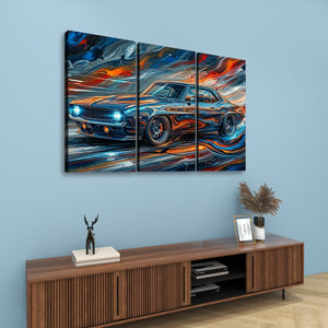 A three-panel canvas wall art set depicting a stylized 1969  Camaro blue sports car with swirling orange, red, and white brushstrokes, displayed above a wooden console table against a light blue wall.