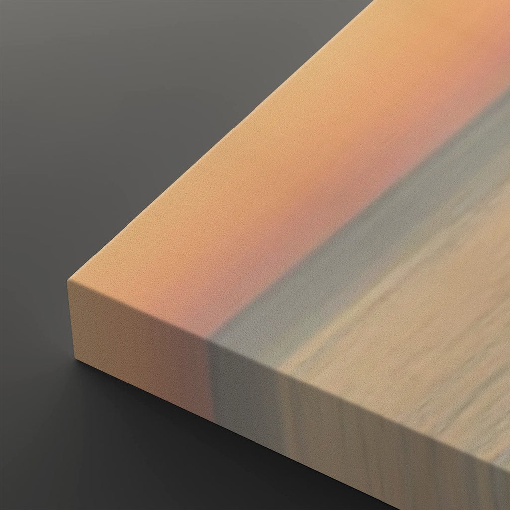 A close-up of a rectangular wood veneer or panel sample showing a warm peach-orange tone on one side and a light natural wood grain on the other, photographed on a dark gray background.