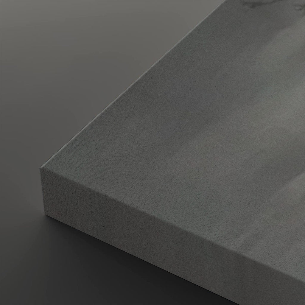 A close-up of a matte gray rectangular panel or tile corner, shown at an angle against a matching dark gray background.