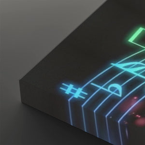 A close-up of a dark rectangular panel or book corner with glowing neon-style musical notation lines in blue, green, and pink on a dark surface.