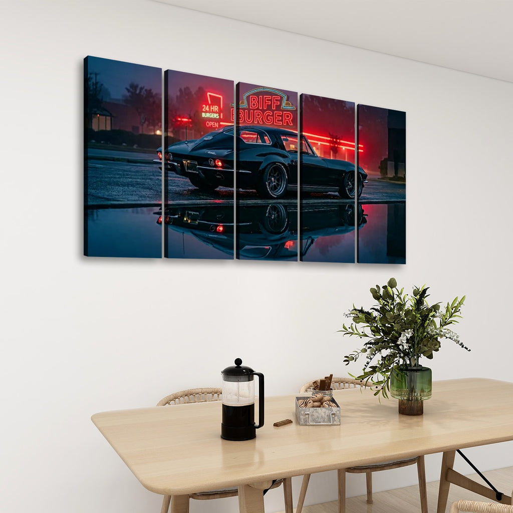 A five-panel canvas wall art set depicting a 1963 Split Window Chevy Corvette at a neon-lit diner, displayed on a white wall above a dining table with chairs, a plant, and a French press.