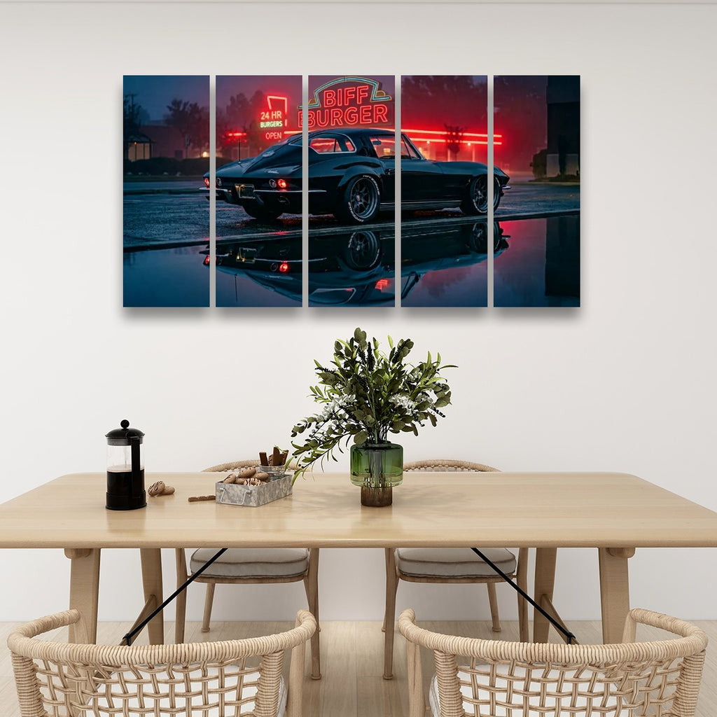 A 4-panel canvas wall art set depicting a classic black car at a neon-lit diner, displayed on a white wall above a dining table with chairs and a vase.