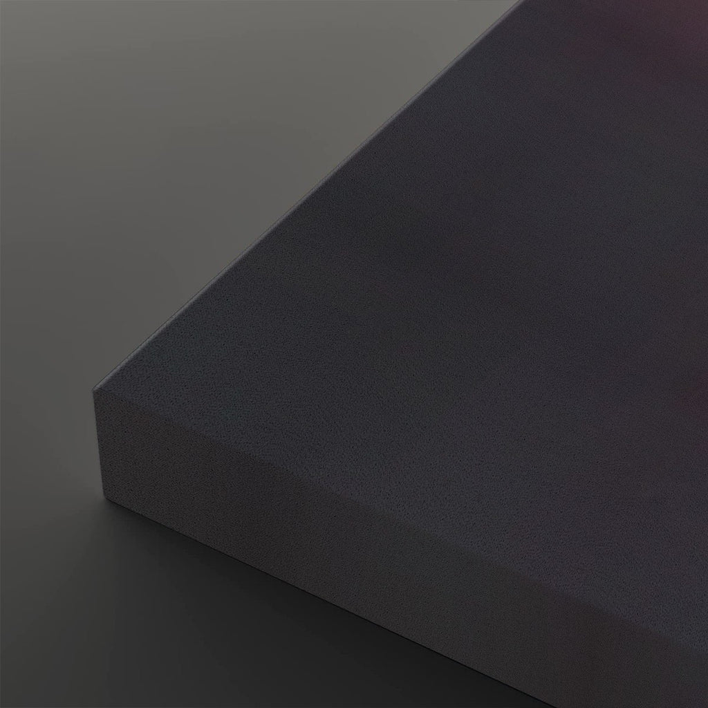 A close-up studio shot of a dark charcoal gray textured rectangular block or panel corner against a matching dark gray background.