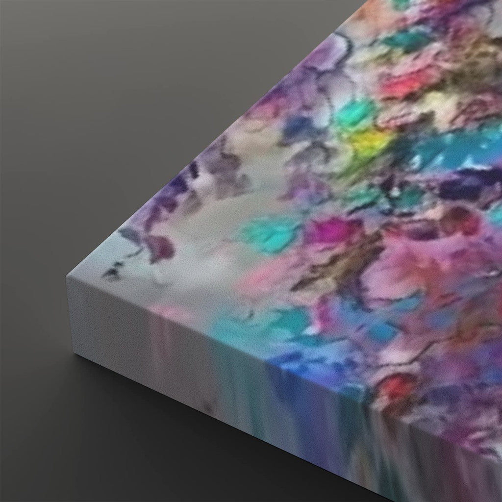 A close-up of a square canvas print showing its wrapped edge, featuring an abstract watercolor design with blended purple, blue, pink, teal, yellow, and white tones on a dark gray background.