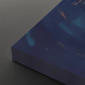 A close-up of a rectangular product corner, likely a box or package, with a dark blue and purple printed surface and subtle abstract light streaks, shown on a dark gray background.