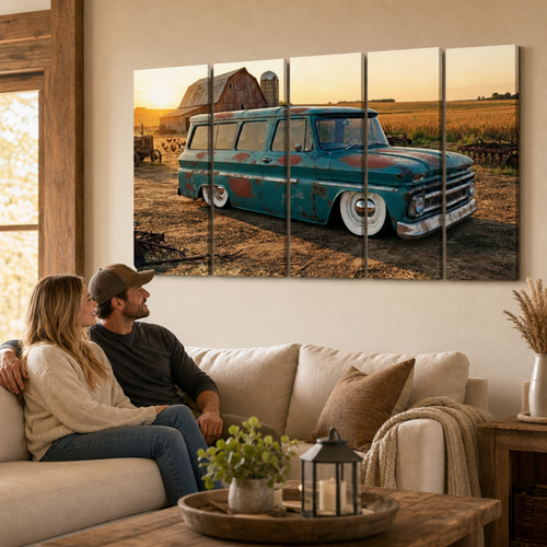 A five-panel canvas wall art print depicting a vintage 1966 Chevy Suburban Carryall  teal station wagon parked in a rural field at sunset, displayed on a beige wall above a living room sofa with a couple sitting underneath.