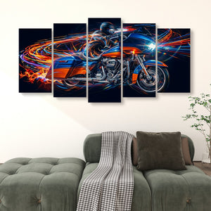 A 5-panel canvas wall art set depicting a blue and orange Road Glide type motorcycle with vibrant light trails, displayed on a wall above a green sofa in a living room setting.