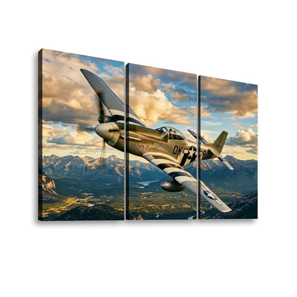 Three-panel canvas wall art showing a vintage military fighter plane flying over mountains under a dramatic cloudy sky, displayed against a plain white background.
