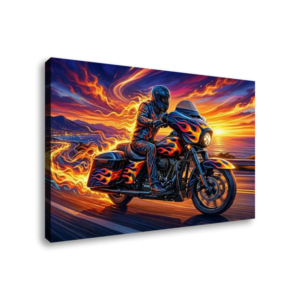 A rectangular canvas wall art print showing a rider on a motorcycle with vivid orange, yellow, blue, and purple flames against a sunset sky, photographed against a plain white background.