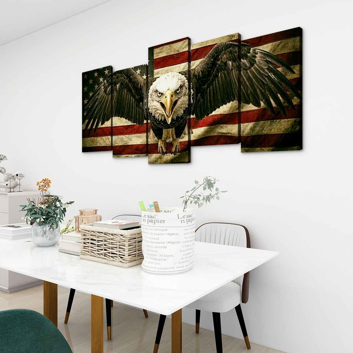A multi-panel canvas wall art set depicting a bald eagle in front of an American flag, displayed on a white wall above a dining table in a modern room setting.