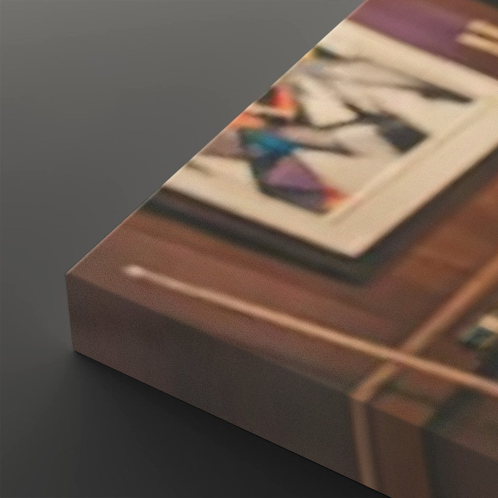 A close-up angled view of a rectangular product, likely a box or package, with a printed surface showing a blurred indoor scene. The visible object is predominantly brown with a dark gray side edge, photographed against a dark gray background.
