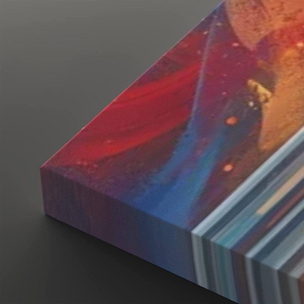 A close-up of a rectangular art print or canvas showing an abstract cosmic scene with swirling red, blue, purple, and orange tones, photographed on a dark gray background.