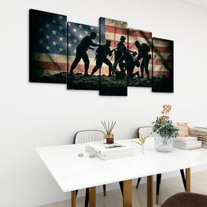 A 5-panel canvas wall art set depicting silhouetted figures carrying a child against a distressed American flag, displayed on a white wall above a dining table in a modern room setting.