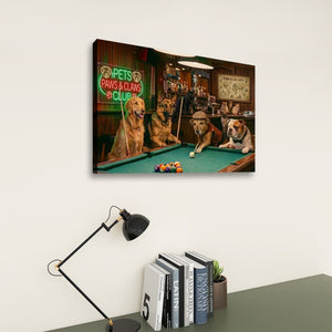 A rectangular wall art print showing several dogs playing pool in a bar scene, displayed above a desk with a black lamp and books against a light gray wall.