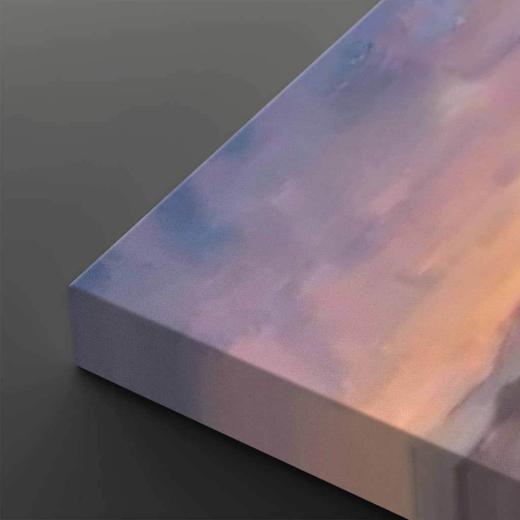 A close-up of a rectangular canvas or block with a soft  pastel lavender, pink, peach, and pale blue, shown on a dark gray background.