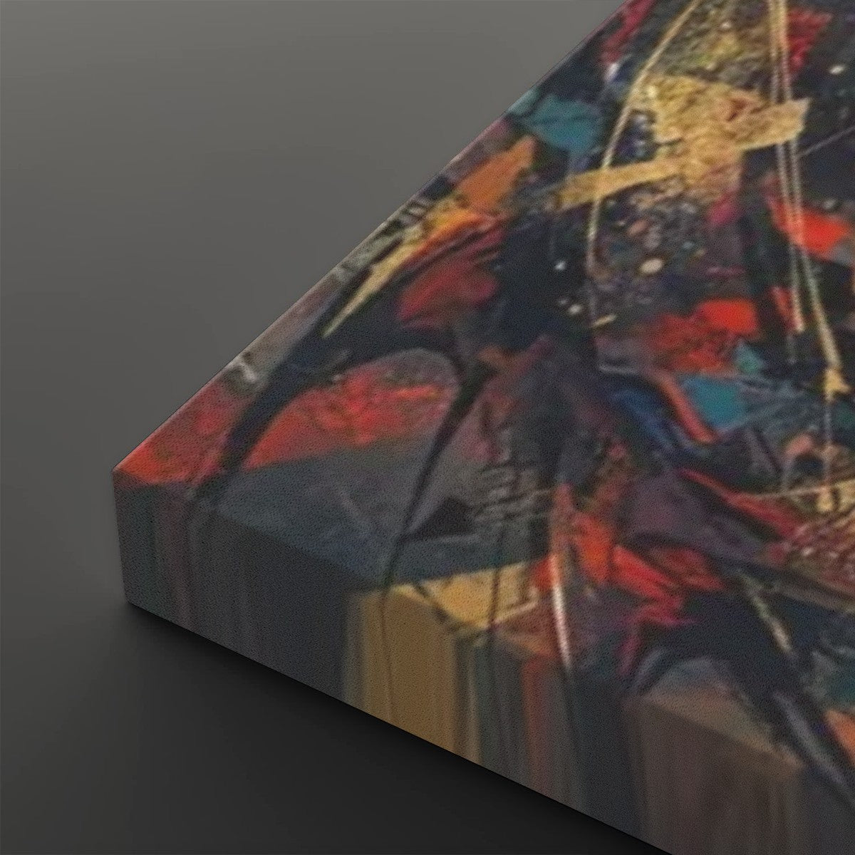 Abstract canvas wall art with a thick wrapped edge, featuring expressive brushstrokes in red, blue, black, gold, and cream on a dark gray background.