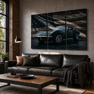 A three-panel canvas wall art print depicting a black 1972 Corvette sports car against a distressed American flag, displayed in a modern living room above a black leather sofa.