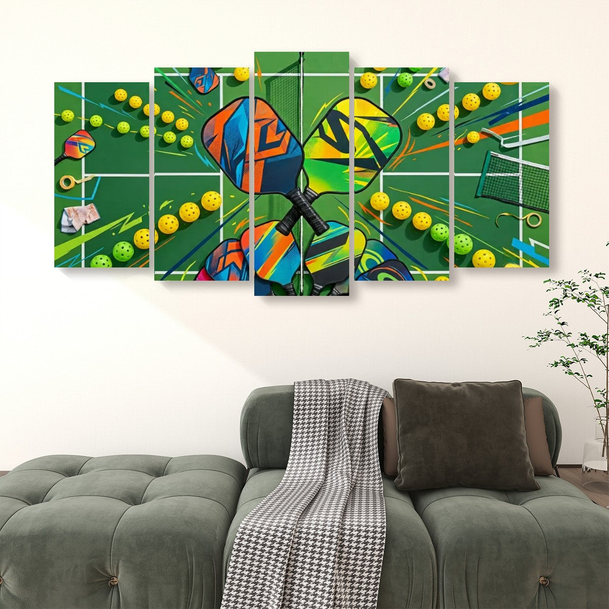 A 5-panel canvas wall art set depicting a colorful, graffiti-style pickleball scene with rackets, balls, and a net on a green background, displayed above a green sofa in a living room setting.