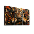 A three-panel canvas wall art set depicting a tiger emerging from an abstract geometric background in warm orange, brown, black, and beige tones, shown against a plain white background.