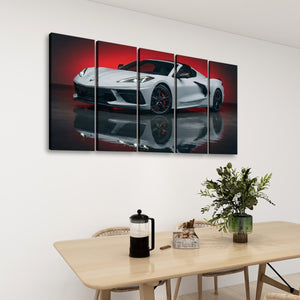 A five-panel canvas wall art set depicting a white sports car on a reflective dark surface with a red background, displayed above a dining table in a modern room setting.