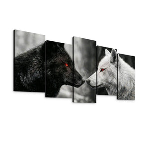 Five-panel canvas wall art showing a black wolf facing a white wolf, with both wolves having glowing red eyes. The panels are arranged in a staggered gallery-style display against a plain white background.