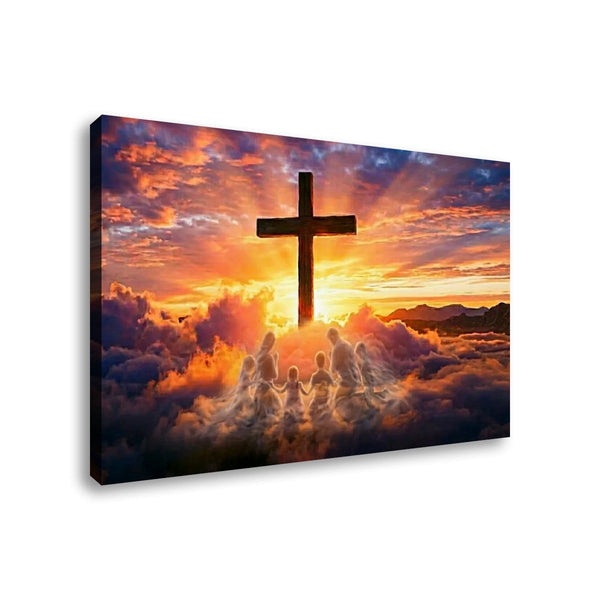 A rectangular wall art canvas showing a dark cross silhouetted against a dramatic sunset sky with clouds and rays of light, photographed at an angle on a white background.