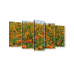 A five-panel canvas wall art set depicting a field of orange flowers with monarch butterflies, shown against a plain white background.